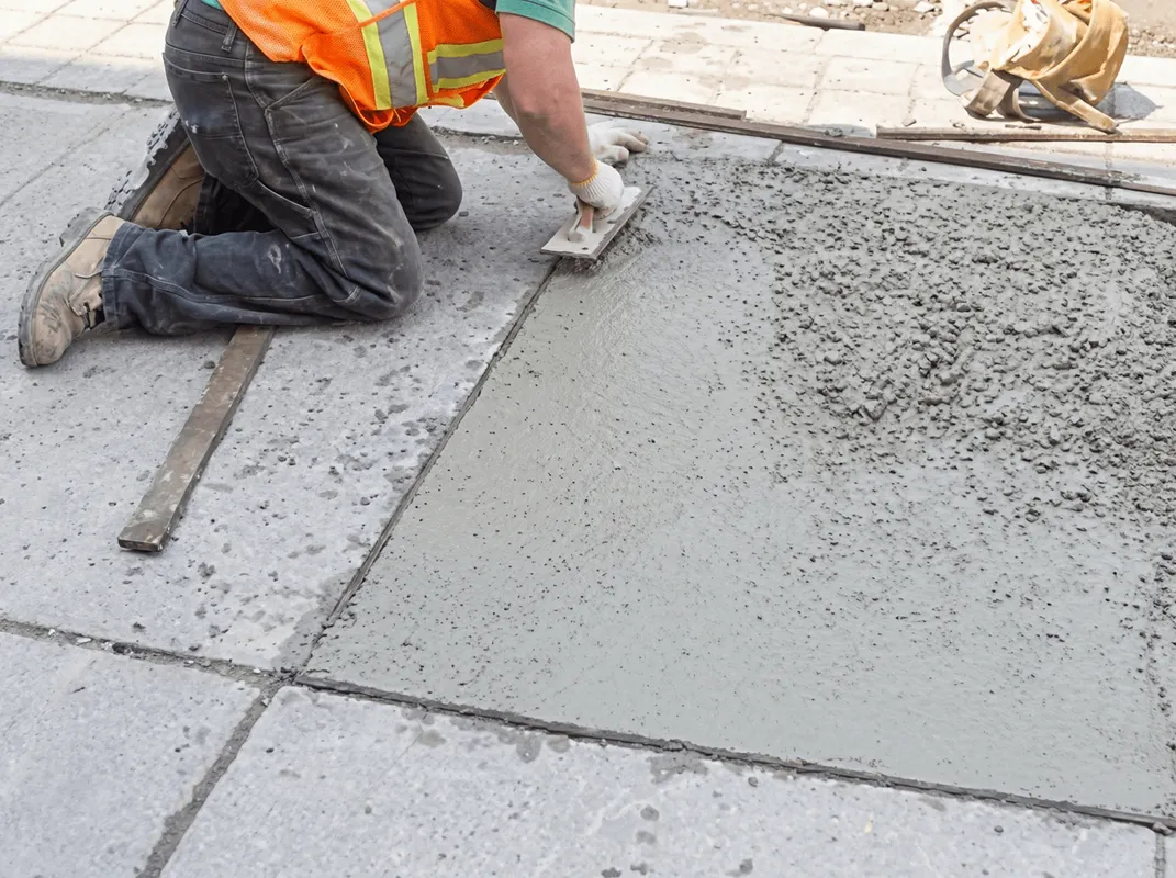 Professional repairing a concrete floor in San Jose, CA